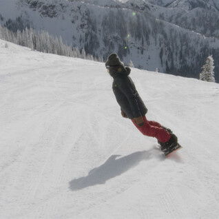 advanturer snowboarder on snowy mountain