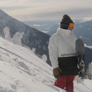 advanturer snowboarder on mountain