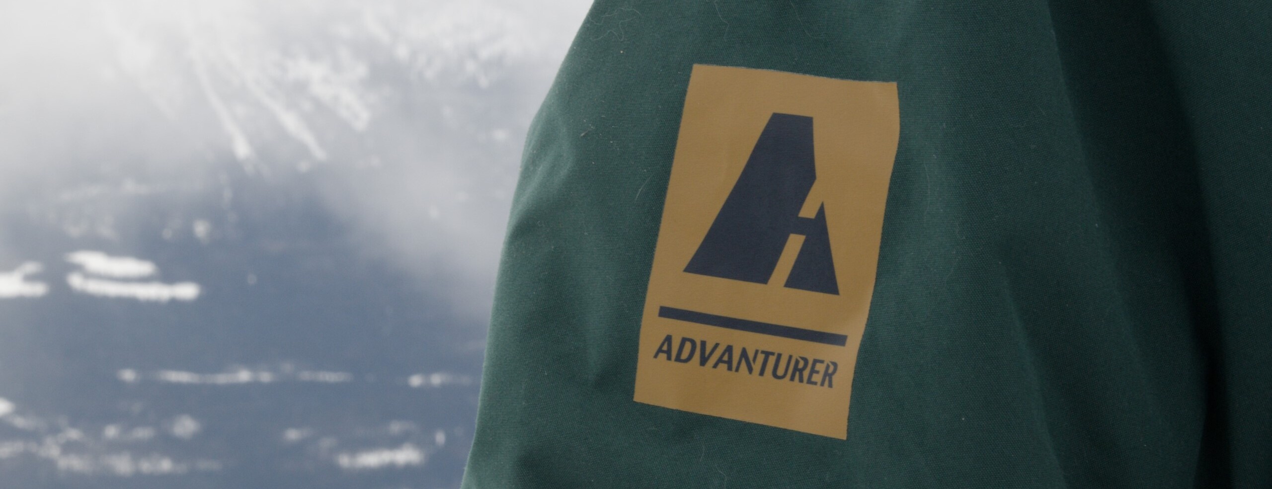 advanturer logo with mountain in background